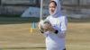 Premier Skills female footballer wearing a hijab and holding a football