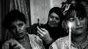 Women hold candles at an Algerian engagement in France