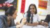 Photo from an MEP Chinese lesson showing a teacher speaking to a student