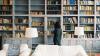 Person standing in front of bookshelves