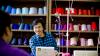 Man learning valuable sewing skills