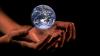 Image of globe in someones hands