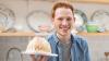 Andrew Smyth holding a baked Alaska 