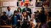 Young people have a discussion in an art gallery