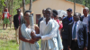 Image of two people carrying the Kwibuka flame