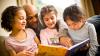 A man reading with three children