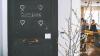 Cafe door with 'bonjour' written on a chalk board