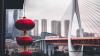 Red lantern in front of an urban scene