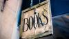 Minimalist sign for books hanging above a wall
