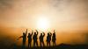Silhouettes of people in a sunset
