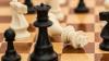 A close up of chess pieces on a board