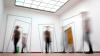Blurred people in a gallery