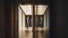 Young man walking in a school hallway