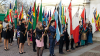 Young people with the flags of Commonwealth Countries.