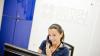 Aptis team member talking on the phone