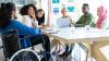 Diverse group of people sitting around a table and talking