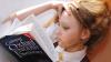 Young woman reads Oxford English Dictionary 