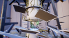 An image created in unreal engine 4, depicting a quantum computer encircled by gold tentacles.