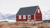 A red house in an Arctic landscape 