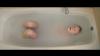Character from the short film I (ÉG) in a bath, viewed from above