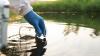 Environment engineer collects samples of wastewater from industrial canals in test tube