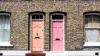 Two pink doors on adjacent terraced houses in England