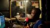Young woman talking in radio booth
