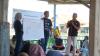 A group of people speaking to an audience.