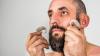 Jonny Cotsen holding hearing aids 