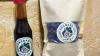 A photo of a bottle and a paper bag.