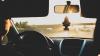 Person driving on a highway as seen from just behind the driver's seat
