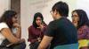 A group of people engaged in conversation.