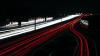 Multiple lines of red and white light joining together. Rush hour traffic motorway tracks light trace. Highway Autobahn A3 West (border to Netherlands) to East (border to Austria) across Germany.