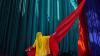 Lady holding long drapes