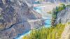 Aerial view of Hunza Valley with mountains, stream and trees.