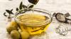 Olive oil in a glass bowl on a kitchen work surface