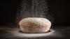 Bread and flour on a kitchen surface
