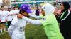 Photo of Egypt's first female coach, Fayza Haider, presenting a medal to a smiling female participant in the Premier Skills programme. Premier Skills is a programme that trains coaches to run community football programmes and teach life skills to young people from disadvantaged communities.
