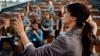 A public speaker presenting to an audience.