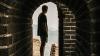 Man standing in archway at the Great Wall of China 