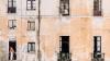 Block of apartments with plants in windows
