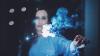 Scientist holding a flaming blue stick