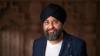 Man wearing turban, smiling.