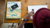 English language learner at desk with book pencil and ruler