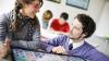 Student and teacher learning a language