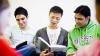 Three young men studying before an exam
