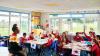A teacher in the classroom with young pupils