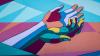 Artist interpretation of hands in multiple colours against a colourful background