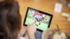 Parent and child watching a video on a tablet