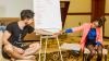 Dan Boyden passing a pen to a participant in an Artivism workshop in the Horn of Africa. 